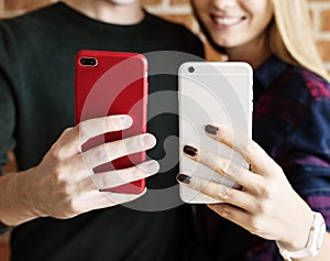 Happy cute young couple using a smartphone