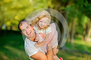 Happy dad with little daughter