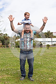 Happy daddy and son having fun outdoors