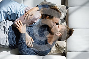 Happy dating couple enjoying romantic leisure time at home