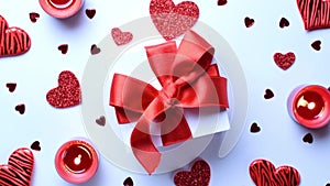 Happy days background. Red love hearts, romantic gift box, Valentines day candle on white table. Romantic message template with co