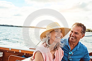 Happy days out at sea. a mature couple enjoying a relaxing boat ride.
