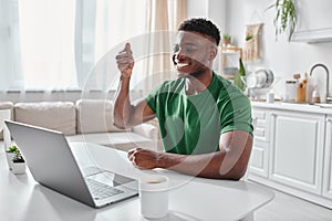 happy deaf african american remote worker