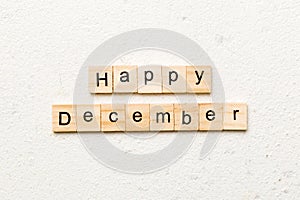 Happy december word written on wood block. Happy december text on table, concept