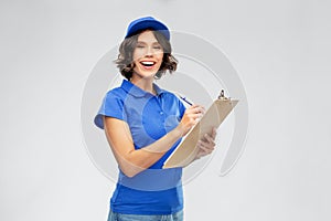 Happy delivery girl with clipboard and pen writing