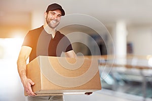 Happy delivery man with box