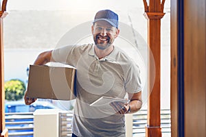 Happy delivery man, box and portrait with tablet for order, parcel or courier service at front door. Male person smiling