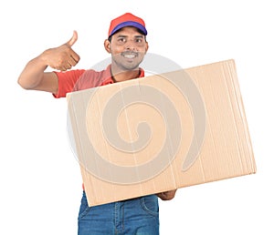 Happy delivery man carrying carton boxes thumb up in uniform