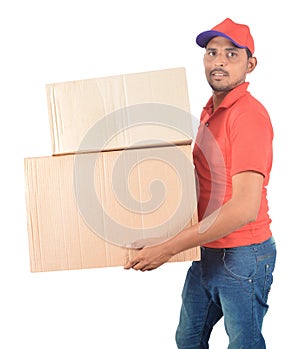 Happy delivery man carrying carton boxes in uniform