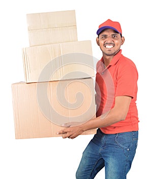 Happy delivery man carrying carton boxes in uniform