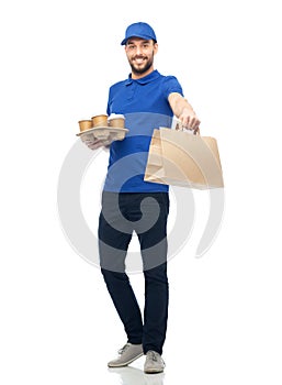 Happy delivery man with coffee and food in bag