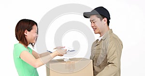 Happy delivery man delivering cardboard box