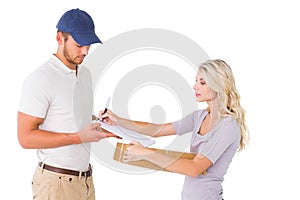 Happy delivery man giving package to customer