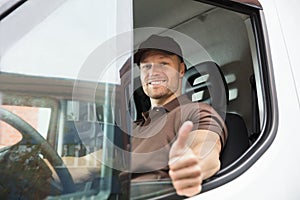Happy Delivery Man Sitting Inside Van