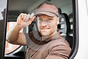 Happy Delivery Man Sitting Inside Van