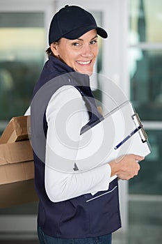 happy delivery woman with clipboard