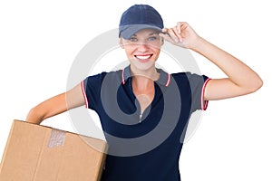 Happy delivery woman holding cardboard box