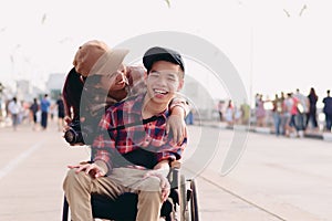 Happy disability kid travel in family holiday concept