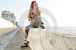 Happy disabled athlete woman with prosthetic leg