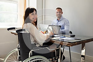 Happy Disabled Businesswoman Working On Laptop