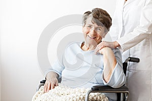 Happy disabled pensioner in wheelchair