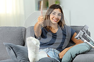 Happy disabled woman with thumbs up