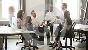 Happy diverse business team employees having fun at corporate meeting