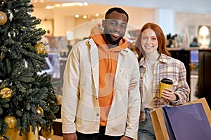 Happy diverse couple at the shopping center