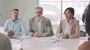 Happy diverse executive business people working together at meeting in office.