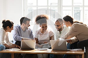 Happy diverse friends having fun, studying at home together