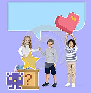 Happy diverse kids with pixilated gaming icons