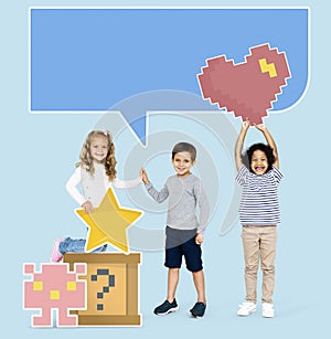 Happy diverse kids with pixilated gaming icons