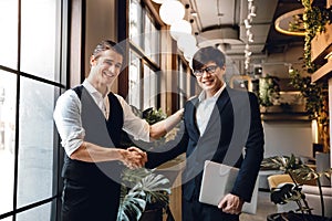 Happy Diversity Business People making Handshake Greeting. Partnership or Teamwork