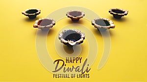 Happy Diwali - Clay Diya lamps during Dipavali, Hindu festival of lights celebration. Colorful traditional oil lamp diya