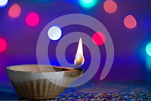 Happy Diwali - Clay Diya lamps lit during Dipavali