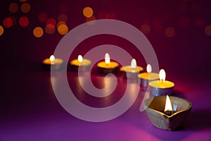 Happy Diwali - Clay Diya lamps lit during Dipavali