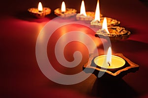 Happy Diwali - Clay Diya lamps lit during Dipavali