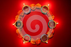 Happy Diwali - Clay Diya lamps lit during Dipavali, Hindu festival of lights celebration. Colorful traditional oil lamp diya on