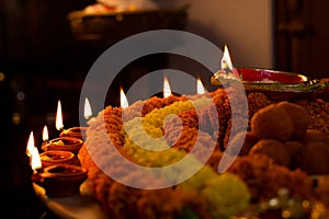 Happy Diwali - Clay Diya lamps lit during Dipavali, Hindu festival of lights celebration. Colorful traditional oil lamp diya and