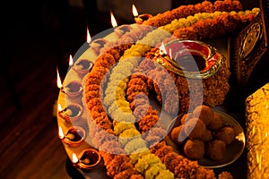 Happy Diwali - Clay Diya lamps lit during Dipavali, Hindu festival of lights celebration. Colorful traditional oil lamp diya and