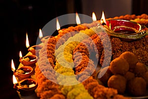 Happy Diwali - Clay Diya lamps lit during Dipavali, Hindu festival of lights celebration. Colorful traditional oil lamp diya and