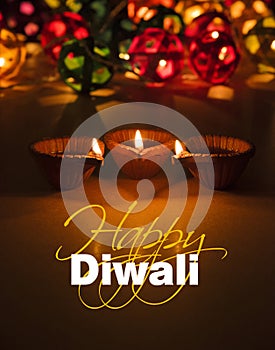 Happy diwali - diwali greeting card with illuminated diya