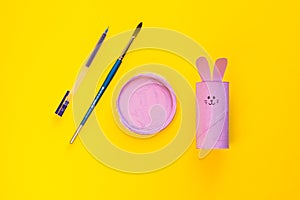 Happy DIY Easter decoration concept bunnies from toilet paper roll tube. Simple creative idea, easy crafts for kids. Eco