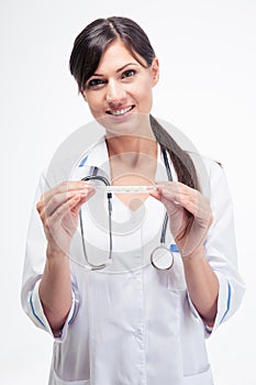 Happy doctor holding clinical thermometer