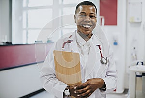 Happy doctor at a hospital photo