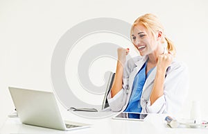 Happy doctor in hospital. Medical success concept.