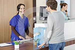 happy doctor at hospital reception