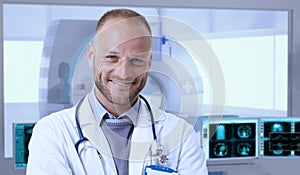 Happy doctor in MRI room at hospital