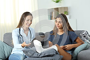 Happy doctor and patient talking at home