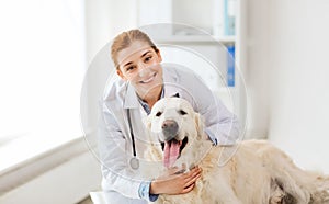 Happy doctor with retriever dog at vet clinic photo